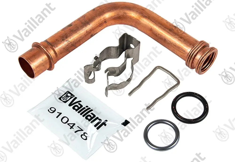 Kupferrohr von Vaillant in gebogener Form, begleitet von verschiedenen Dichtungen und Halterungen in einer Verpackung.
